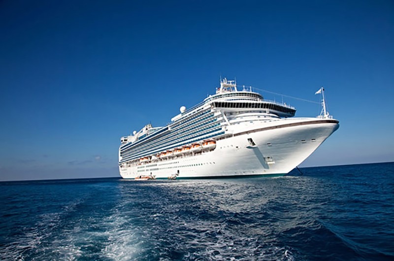 Luxury white cruise ship sailing through clear blue ocean under a bright sky, symbolizing marine transportation and marine casting services for marine companies.