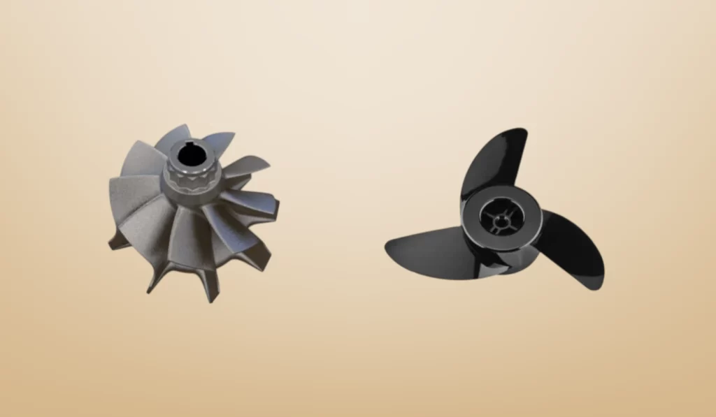 Two metal propellers: a larger turbine-style propeller on the left and a three-blade propeller on the right, set against a soft beige background.